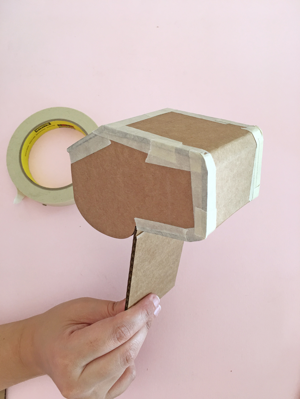 How To Make a Felt Dinosaur Bag Tutorial: Bend the cardboard around the dinosaur face.